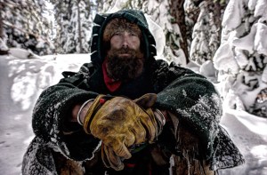 COLO.- Derik sitting in the snow, with snow covered trees in the background. (Photo Credit: NG Studios/Mary Way)