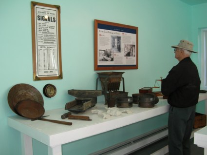 AOM Visitor Looking at Interpretive Panel